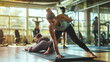 Personal trainer assisting a client performing yoga stretches in a modern gym emphasizing personal development and coaching.