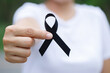woman with black ribbon For patients with breast and cervical cancer