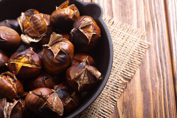 Wall Mural - Tasty fried chestnut snack background