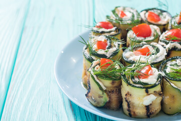 Wall Mural - Zucchini rolls with cream cheese , tomatoes and dill