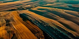 Fototapeta  - aerial view of vast fields with intricate crop patterns, illustrating the scale and precision of spring planting. Generative ai