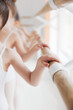 Close-up of children's hands gripping ballet barre, focusing on dance form and discipline. Classical ballet school. Concept of art, sport, education, hobby, active lifestyle, leisure time.