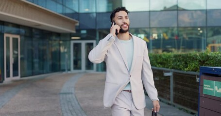 Canvas Print - Business man, city and phone call with attorney briefcase and bag with networking and conversation. Urban, travel and morning commute with mobile communication and happy walking in town with tech