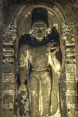 Wall Mural - Ajanta caves, a UNESCO World Heritage Site in Maharashtra, India. Statue in cave nÂ°6.