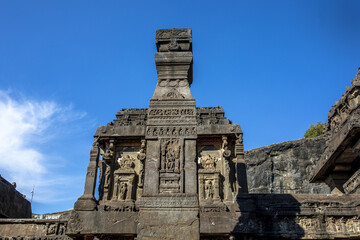 Wall Mural - Ellora caves, a UNESCO World Heritage Site in Maharashtra, India. Stone Diya Stambha pillar in the Kailash temple