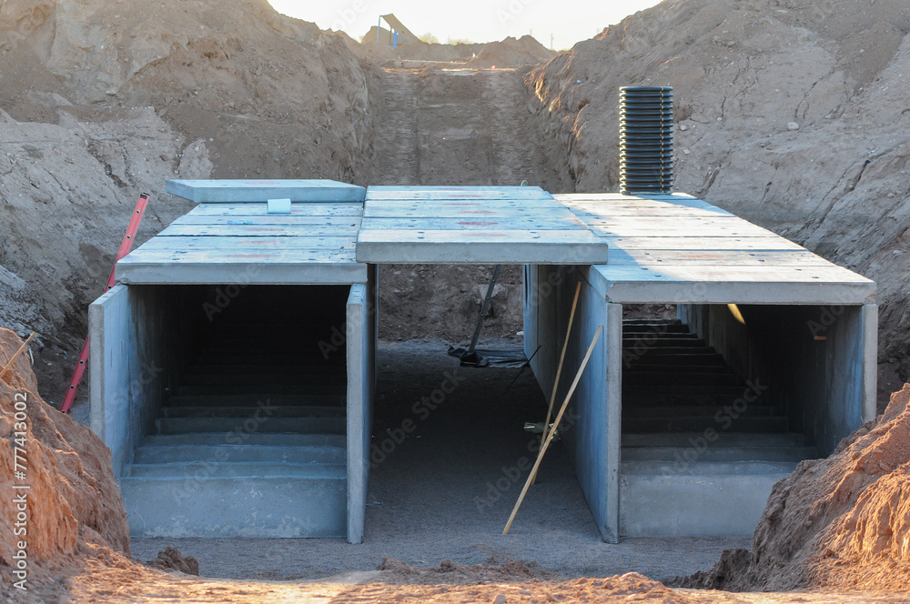 Culvert Under Ramp Precast concrete box culvert structure under installation in excavation ...