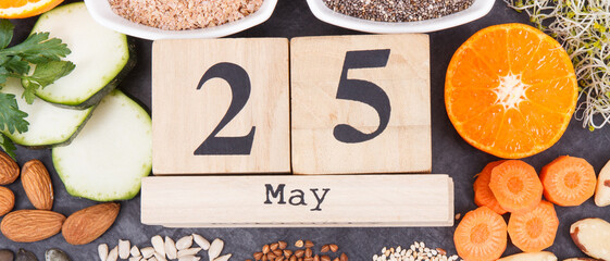 Wall Mural - Nutritious food and May 25 on calendar as date of World Thyroid Day. Problems with thyroid. Ingredients containing natural vitamins