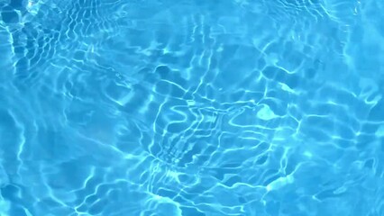 Sticker - Natural pure blue water surface background. Soft water waves with light reflections. flowing ripples in slow motion. 4K shot for cosmetic and design advertising