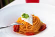 Italian pasta - spaghetti with stracciatella cheese closeup, mediterranean diet.