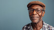 Warm senior man in cap and glasses with a gentle smile