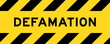 Yellow and black color with line striped label banner with word defamation