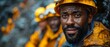 African mine workers in gear discuss coal quality at mine site. Concept Coal mining, African workers, Coal quality, Mine site, Gear, Discussion