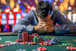 Gambling addiction concept, man defeated after losing his money at a casino table