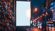 Vertical blank white billboard on city street. In the background buildings and road. Mock up. Poster on street next to roadway