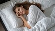 © Moon Story - A woman is sleeping on a bed with a white pillow