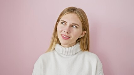 Canvas Print - Thinking and smiling, beautiful blonde girl standing and looking away side, isolated on pink background