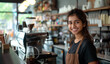Smiling barista at cozy café counter with warmth and hospitality. Coffee machine and various utensils add to ambiance of coffee shop. Bright and inviting atmosphere for delightful coffee experience
