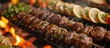 A detailed view of a skewer loaded with various meats and vegetables grilling on a barbecue, emitting sizzling sounds and enticing smells.