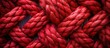 Detailed close-up of a vibrant red rope, showcasing its texture and color.