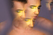 © Anastasia Antonova/Stocksy - Male Model in Makeup Look Poses in Studio