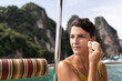 © Alvaro Lavin/Stocksy - Woman Applying Sunscreen on Boat in Thailand