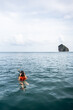 © Alvaro Lavin/Stocksy - Woman Snorkeling in the Serene Waters of Thailand With Distant Island