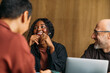 © Studio Firma/Stocksy - Relaxed business meeting in cafe