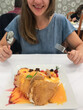 © Hernandez & Sorokina/Stocksy - Anonymous Woman Excited To Eat Huge Dessert
