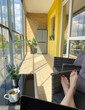 © Hernandez & Sorokina/Stocksy - Anonymous Woman Using Laptop At Her Home Terrace