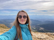 © Hernandez & Sorokina/Stocksy - Woman Selfie Hiking On The Mountain