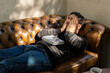 © Eloisa Ramos/Stocksy - Mature Man Asleep On The Couch