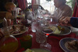 © Anna Malgina/Stocksy - A family having Xmas dinner