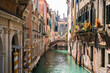 © Oleksandr Shcherban/Stocksy - Beautiful street in Venice with canal and bridge