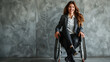 Happy businesswoman on wheelchair, company leader CEO boss executive, concept of entrepreneurship and diversity, Portrait of a young woman isolated on gray wall background.
