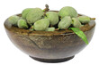 green almonds (cagla badem) from Turkey in a wooden bowl isolated on white background