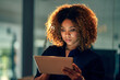 © peopleimages.com - Business, woman and tablet with reading of research at night for creative deadline and project planning. Professional, employee and technology in office for software test management and efficiency