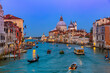 Basilica of Santa Maria della Salute and Grand Canal in Venice at night, Italy