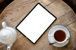 © DZ FILM/Stocksy - Tablet with white screen on the table