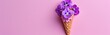 little violets in a small bouquet in ice cream cone isolated on pink background