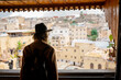 © Mauro Grigollo/Stocksy - A woman visiting a tannery in Fes