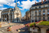 Fototapeta Nowy Jork - Place Grangier and Temple street in Dijon with the Poste building. Dijon is a city that serves as the prefecture of the Cote-d'Or department.
