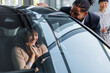 © Jovo Jovanovic/Stocksy - Excited couple examining new car at dealership