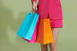 © Marc Tran/Stocksy - shopping bags of women crazy shopaholic person at shopping