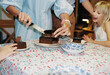© Tanya Yatsenko/Stocksy - Senior woman cutting the cake