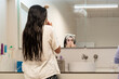 © Eloisa Ramos/Stocksy - sisters kids girls brushing teeth before bedtime