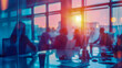 Blurred silhouette of a corporate team meeting in a modern office at sunset