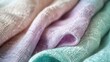 Close-up detail of a split fabric design, one half in a soft, smooth pastel lavender satin, and the other half in a textured pastel mint green tweed, showcasing the contrast in fabric types.
