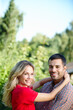 © peopleimages.com - Couple, hug and smile in park portrait, love and commitment to relationship in outdoor nature. Happy people, bonding and embrace in marriage, romance and together on vacation or holiday date by trees