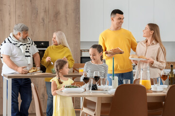 Canvas Print - Big family having dinner in kitchen