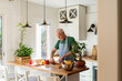 © Alba Vitta/Stocksy - Man cook at kitchen